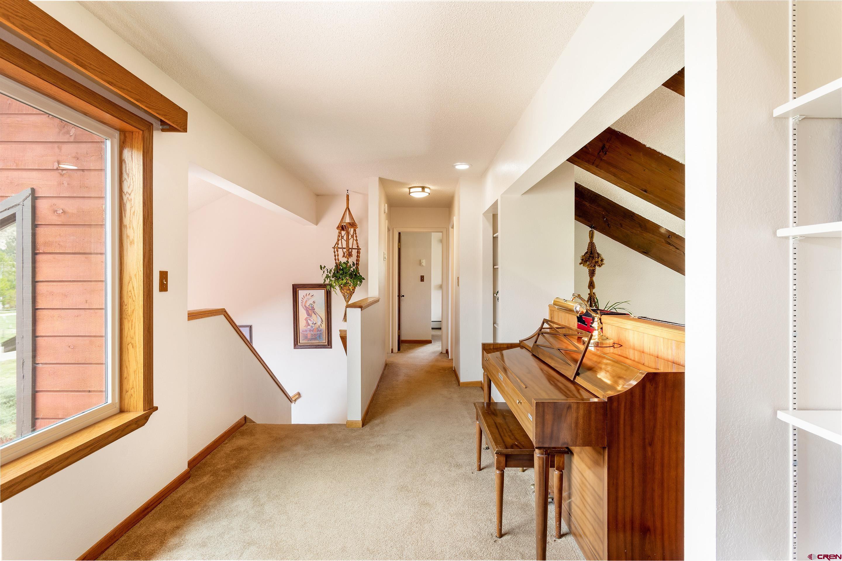 30 Moenkopi Drive Durango, CO 81301 - Photo 16 of 35 a view of an entryway with wooden floor and windows