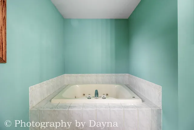 a view of a bath tub sitting in a bathroom