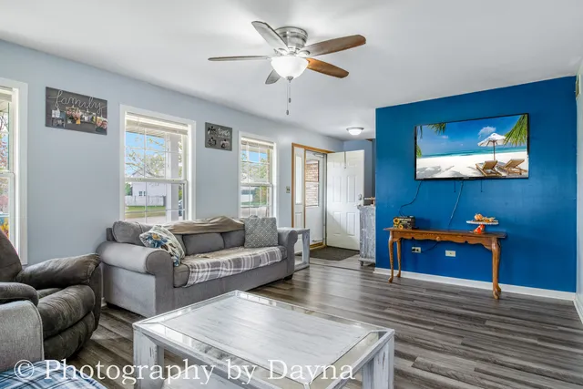 a living room with furniture and a flat screen tv