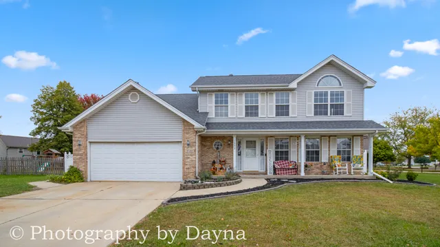 a view of a house with sitting area and garden