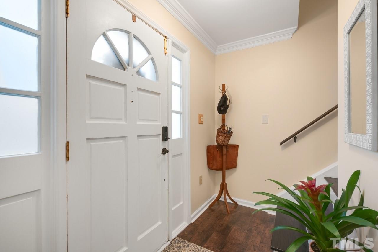 1720 Township Circle Raleigh, NC 27609 - Photo 3 of 27 a view of hall with wooden floor