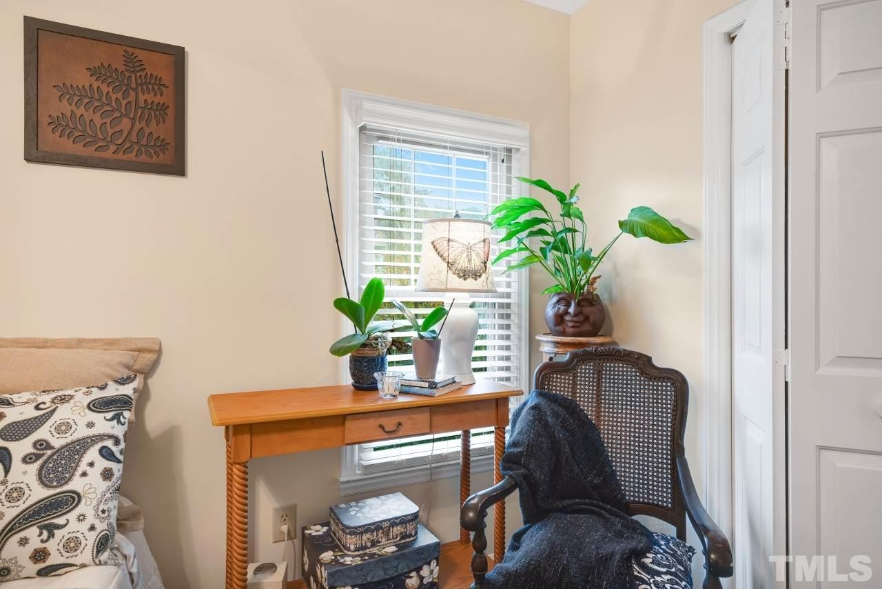 1720 Township Circle Raleigh, NC 27609 - Photo 22 of 27 a view of a workspace with furniture and a potted plant
