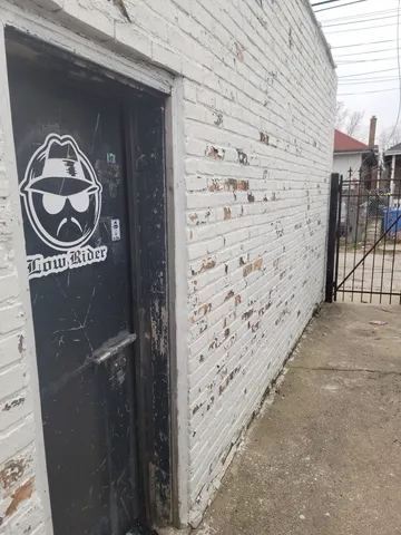 a view of a door and wooden wall