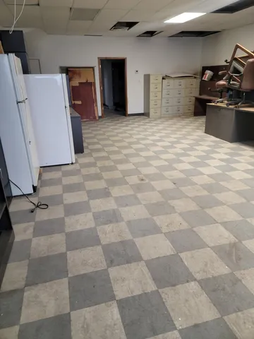 a view of a kitchen with a sink and a stove top oven