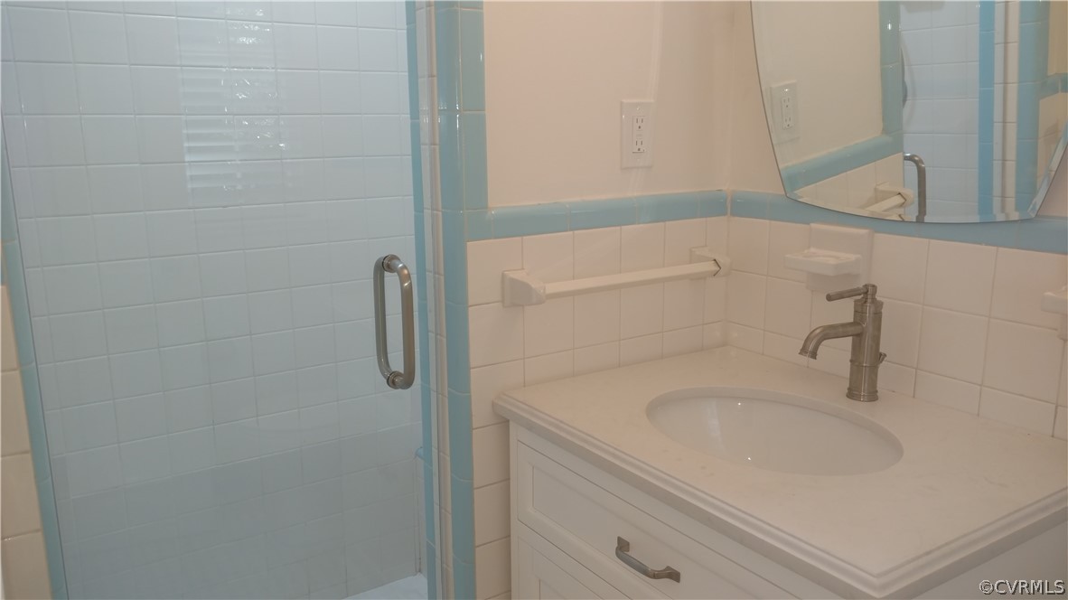 8316 Abbey Road Richmond, VA 23235 - Photo 11 of 15 a bathroom with a sink and shower