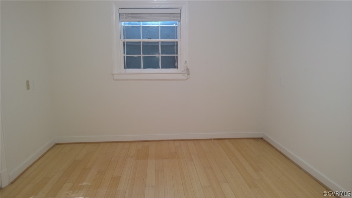 8316 Abbey Road Richmond, VA 23235 - Photo 13 of 15 an empty room with a window