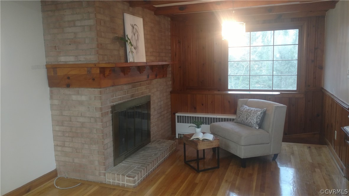 8316 Abbey Road Richmond, VA 23235 - Photo 6 of 15 a living room with furniture and a fireplace