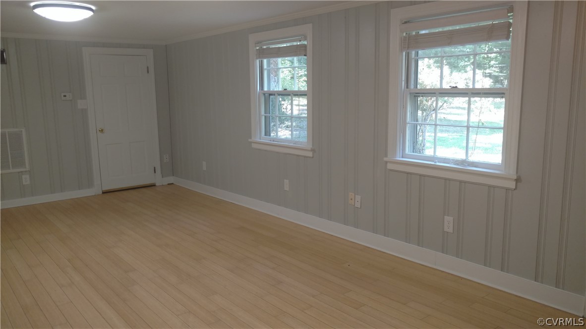 8316 Abbey Road Richmond, VA 23235 - Photo 10 of 15 an empty room with windows