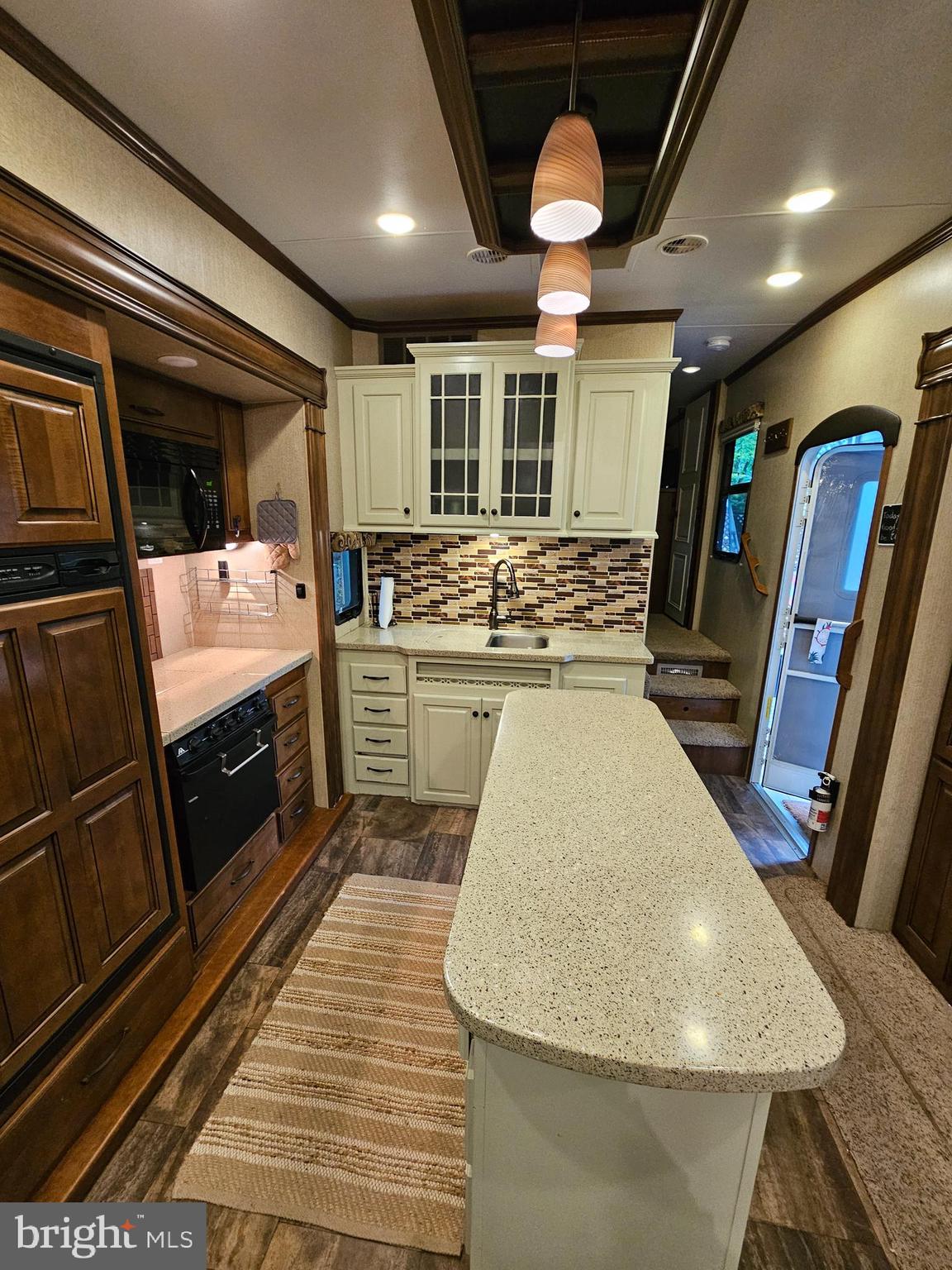 18 Hot Dog Road Falling Waters, WV 25419 - Photo 14 of 35 a large kitchen with stainless steel appliances granite countertop a sink and cabinets