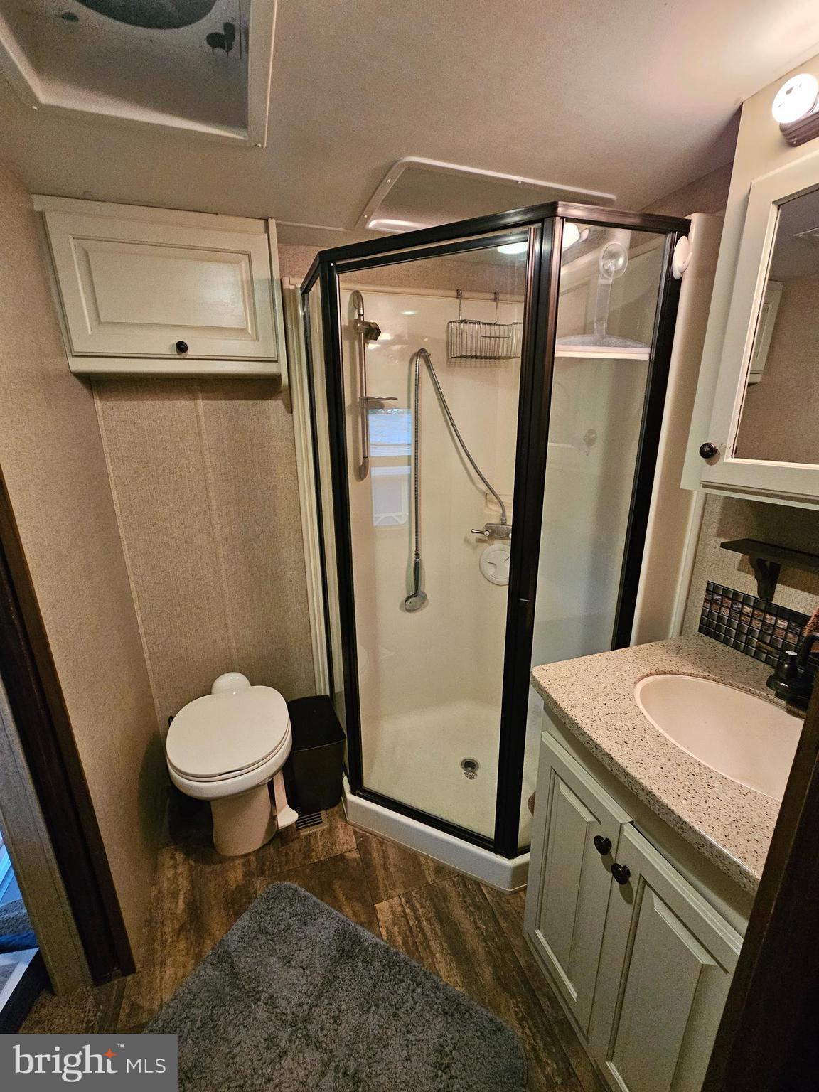 18 Hot Dog Road Falling Waters, WV 25419 - Photo 22 of 35 a bathroom with a sink a toilet a mirror and tub