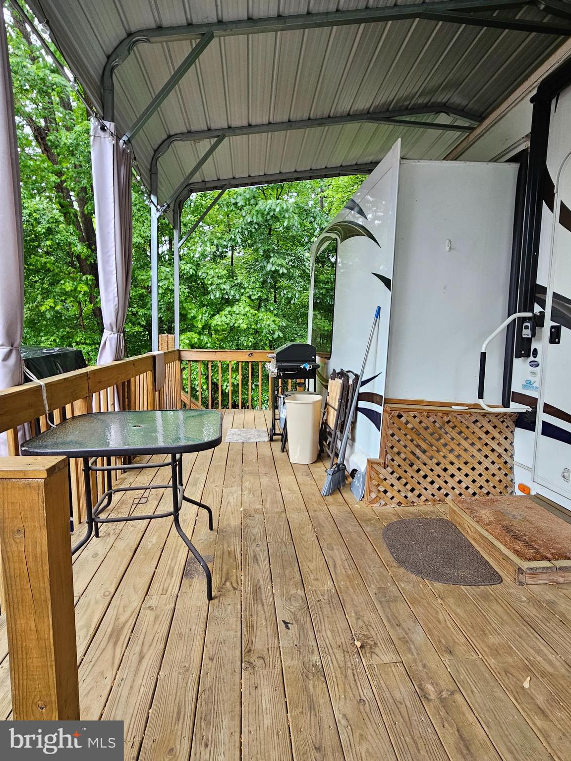 18 Hot Dog Road Falling Waters, WV 25419 - Photo 4 of 35 a view of balcony with wooden floor and outdoor seating