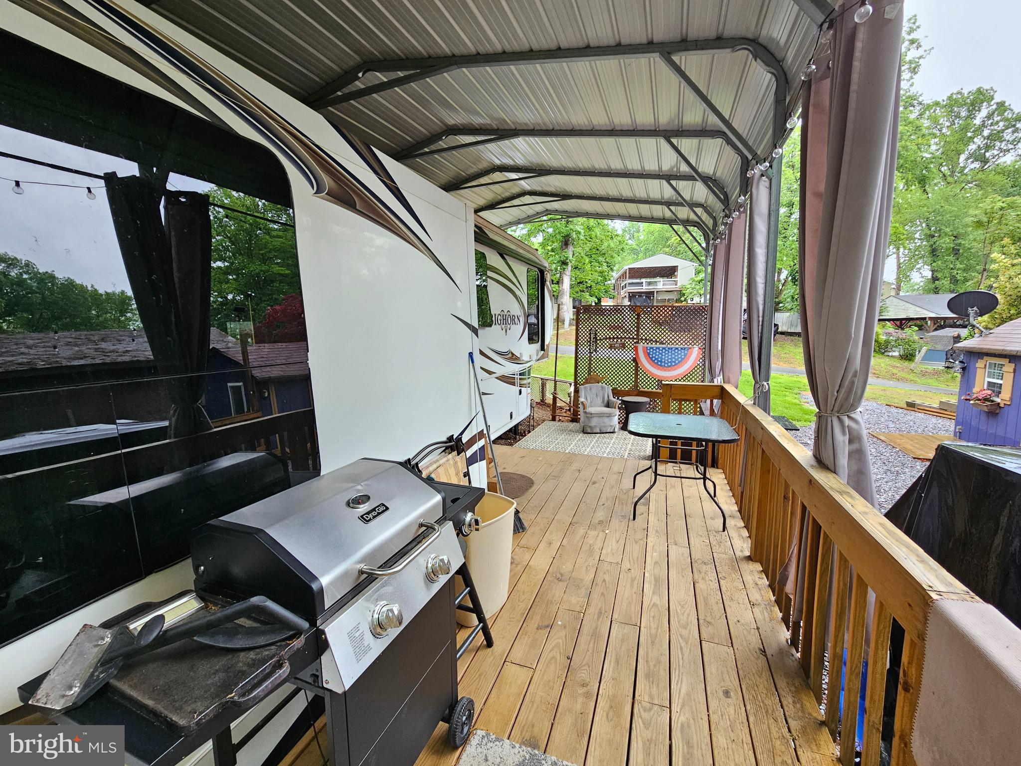 18 Hot Dog Road Falling Waters, WV 25419 - Photo 6 of 35 a balcony with wooden floor table and chairs