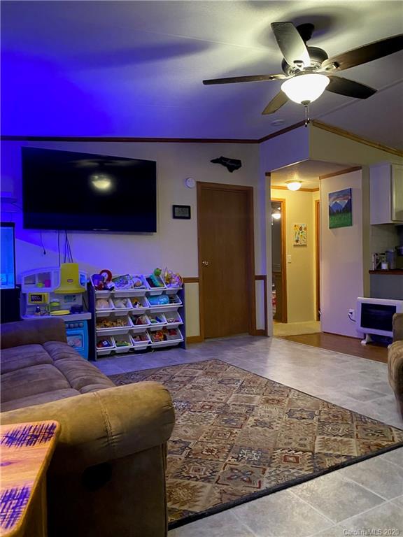 434 Dock Ratcliff Road Waynesville, NC 28786 - Photo 11 of 26 a living room with furniture and a flat screen tv