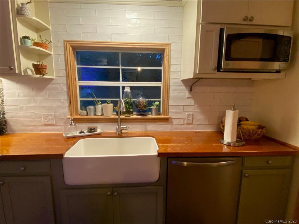 434 Dock Ratcliff Road Waynesville, NC 28786 - Photo 13 of 26 a kitchen with a sink and a microwave
