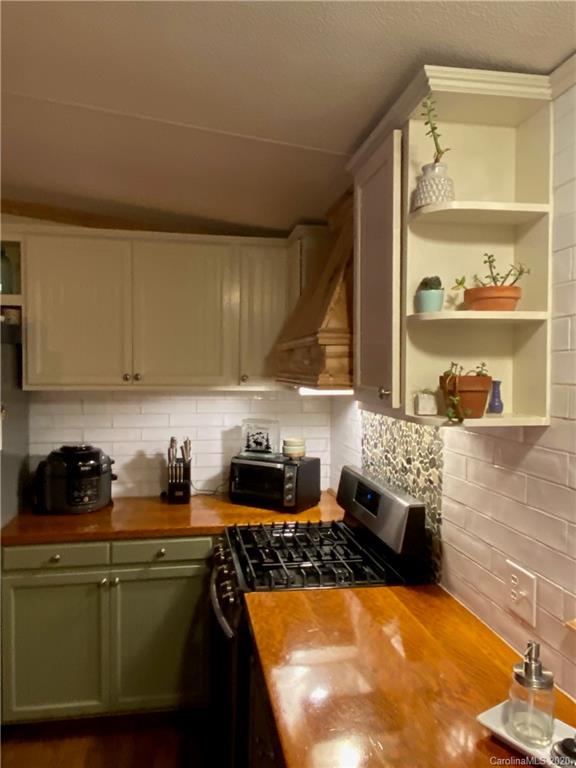 434 Dock Ratcliff Road Waynesville, NC 28786 - Photo 14 of 26 a kitchen with sink a stove and cabinets