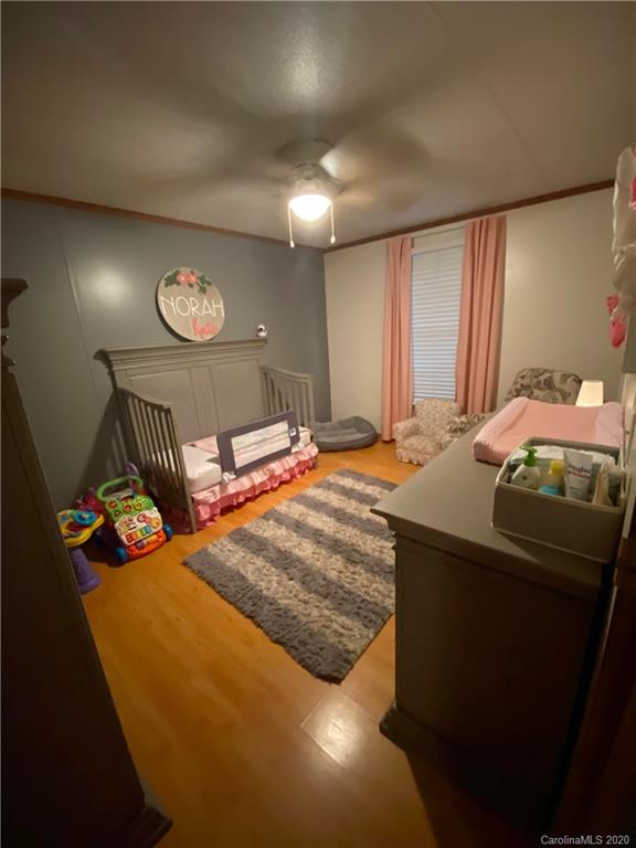 434 Dock Ratcliff Road Waynesville, NC 28786 - Photo 19 of 26 a bedroom with a bed and a closet