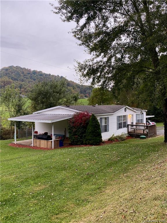 434 Dock Ratcliff Road Waynesville, NC 28786 - Photo 3 of 26 a front view of a house with garden