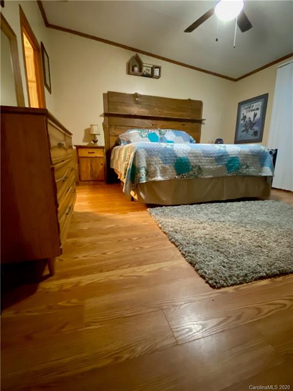434 Dock Ratcliff Road Waynesville, NC 28786 - Photo 24 of 26 a bedroom with double bed and a window