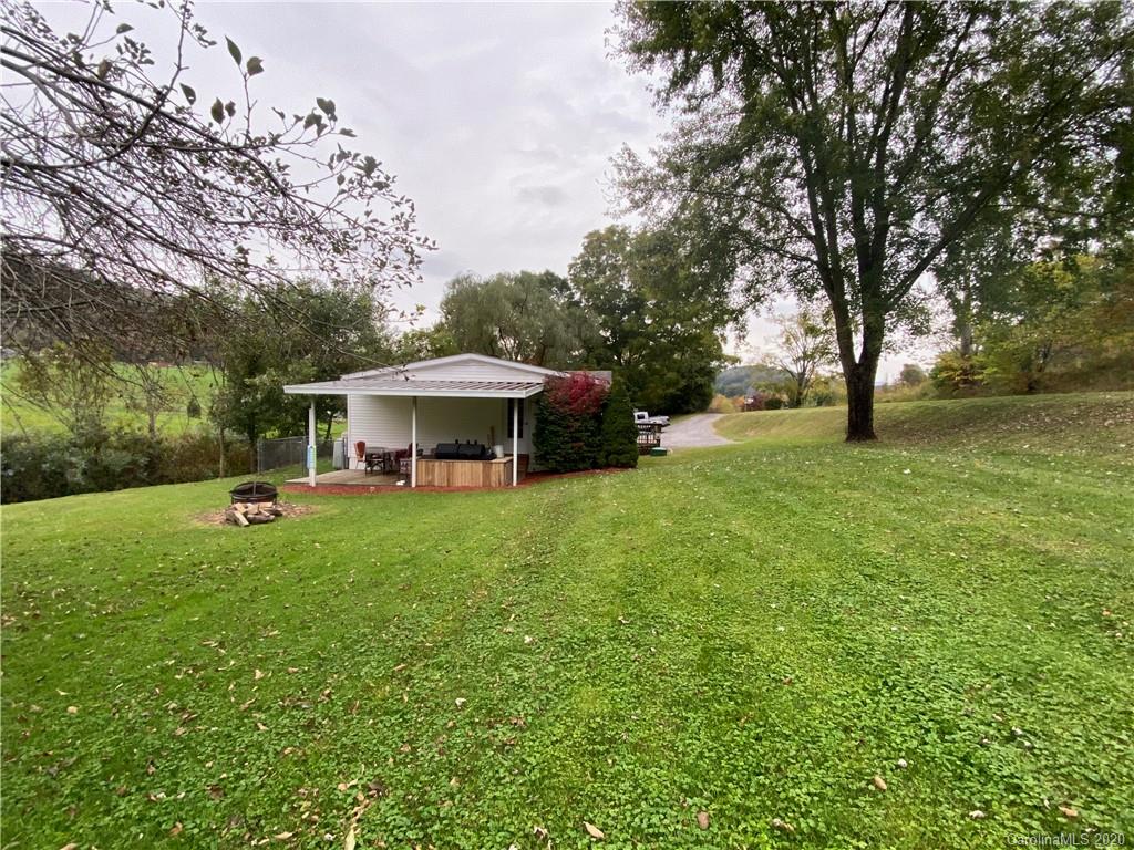 434 Dock Ratcliff Road Waynesville, NC 28786 - Photo 4 of 26 a view of a garden with an outdoor space