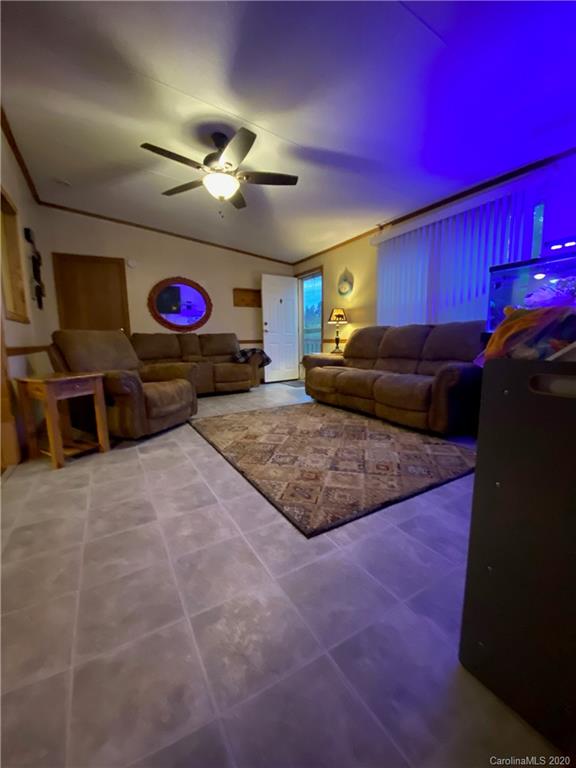 434 Dock Ratcliff Road Waynesville, NC 28786 - Photo 10 of 26 a living room with furniture and a flat screen tv