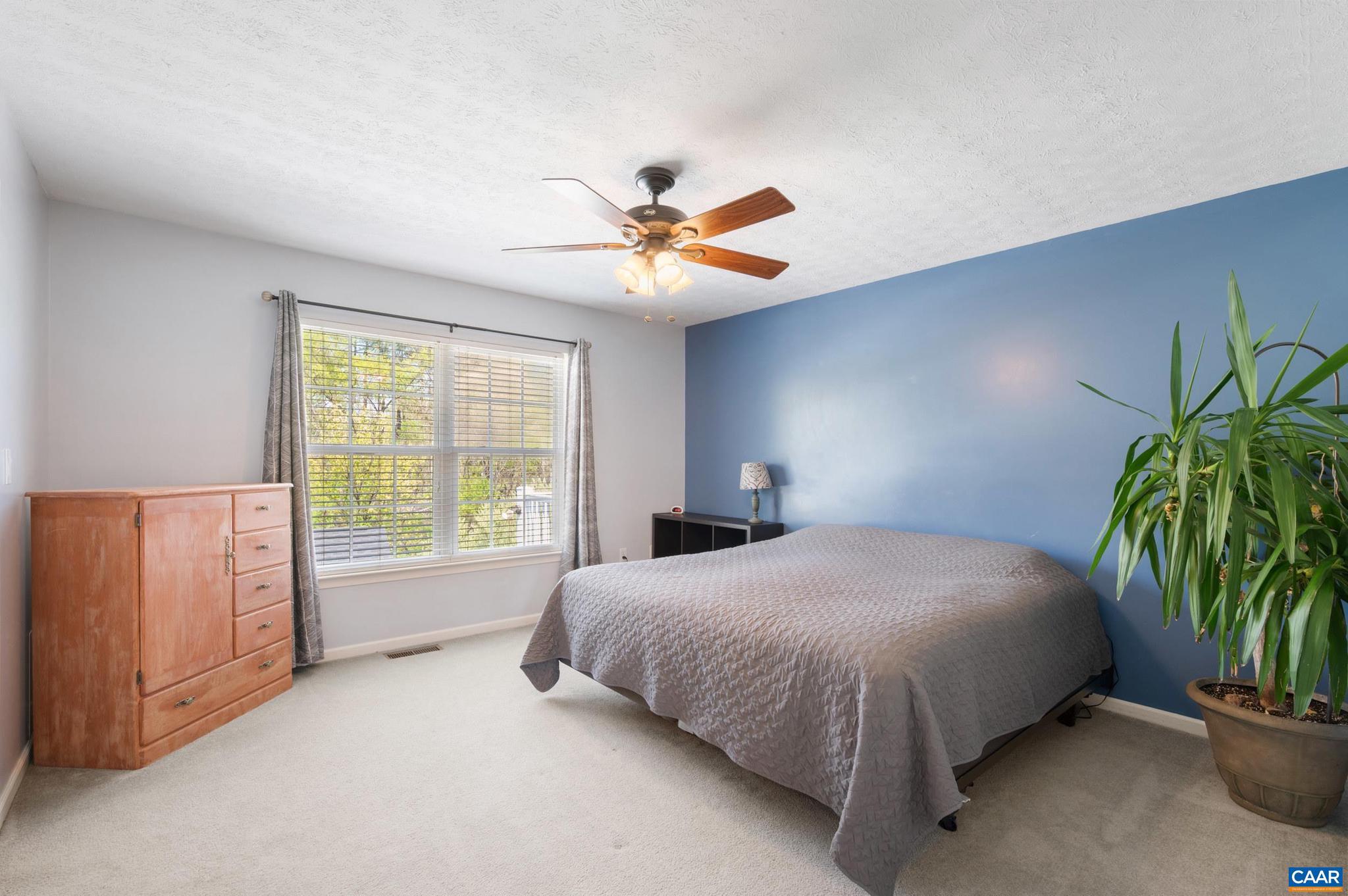 225 Mayfield La Waynesboro, VA 22980 - Photo 15 of 56 a bedroom with a bed and a potted plant