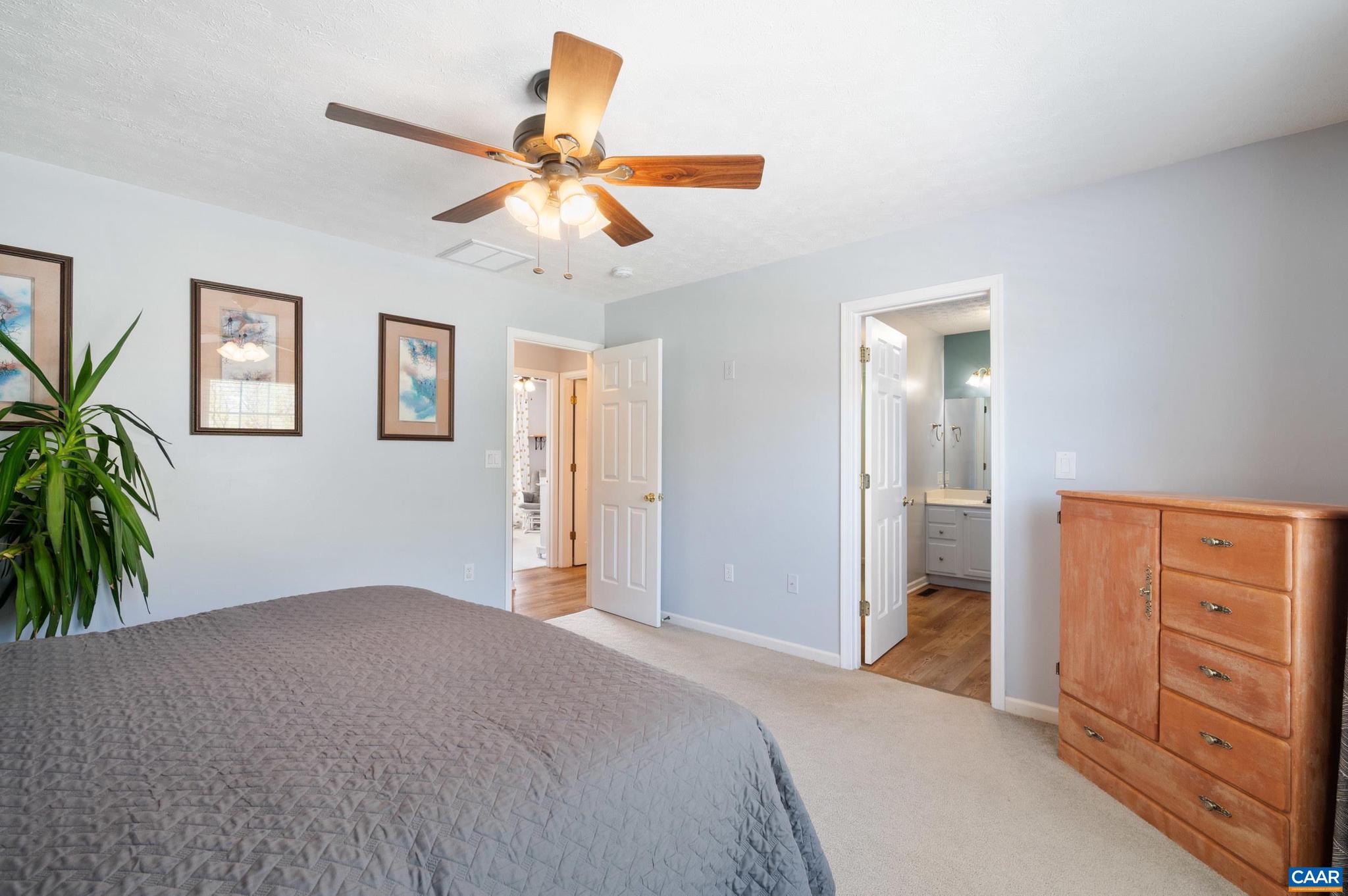 225 Mayfield La Waynesboro, VA 22980 - Photo 16 of 56 a bedroom with a bed and a chandelier