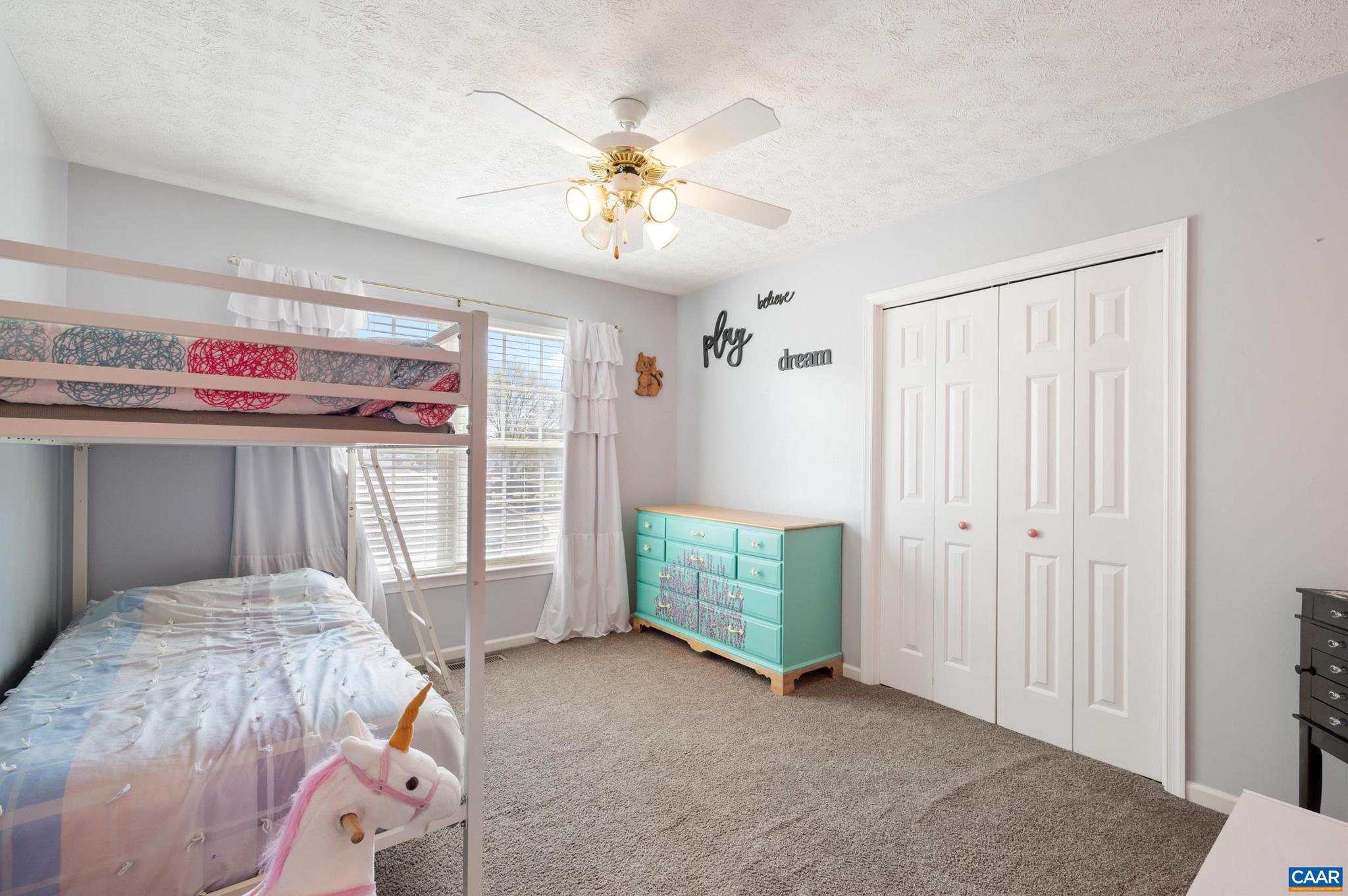 225 Mayfield La Waynesboro, VA 22980 - Photo 21 of 56 a bedroom with a bed and a chandelier