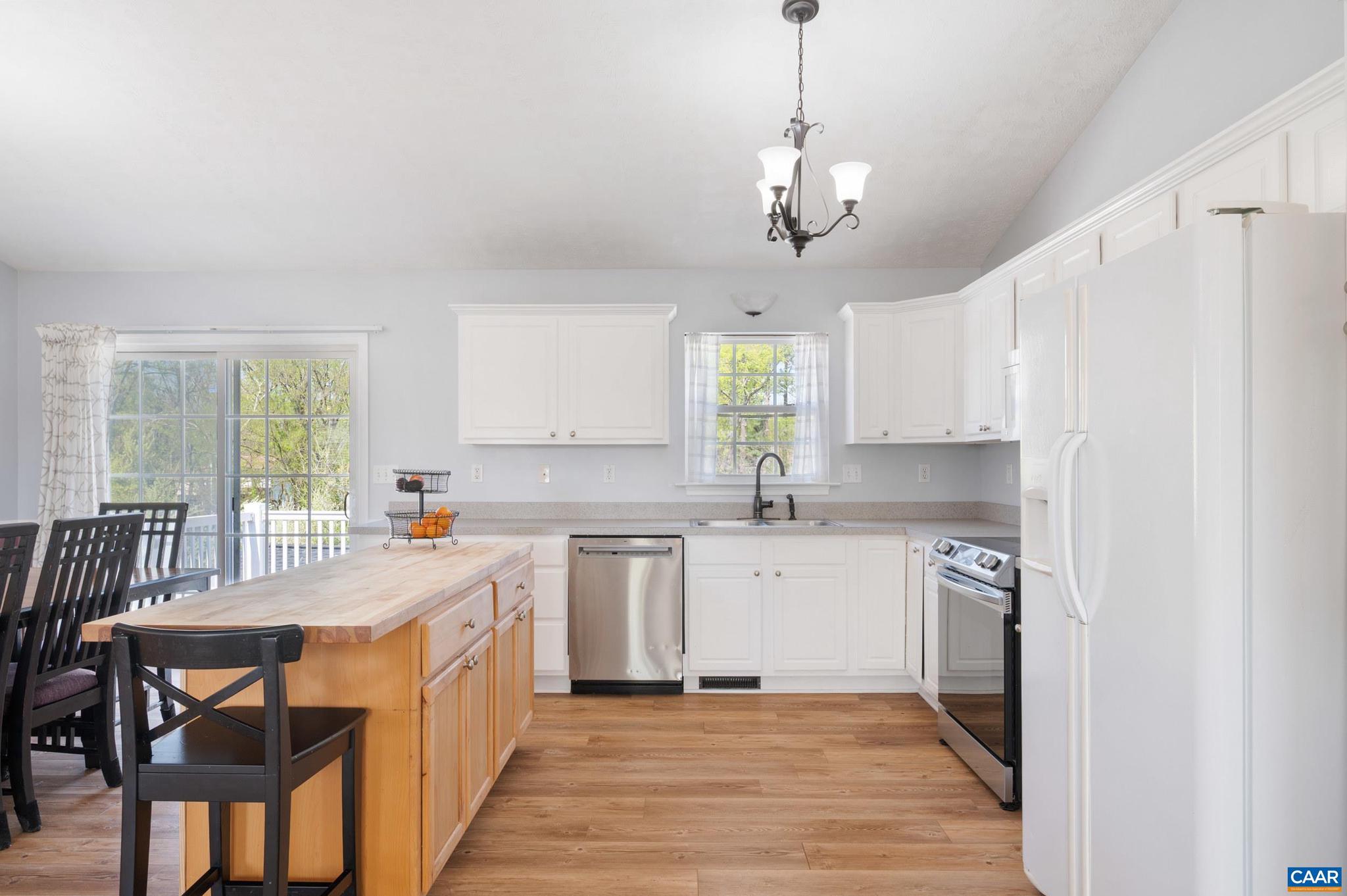 225 Mayfield La Waynesboro, VA 22980 - Photo 4 of 56 a large kitchen with stainless steel appliances granite countertop a sink a stove a dining table and chairs