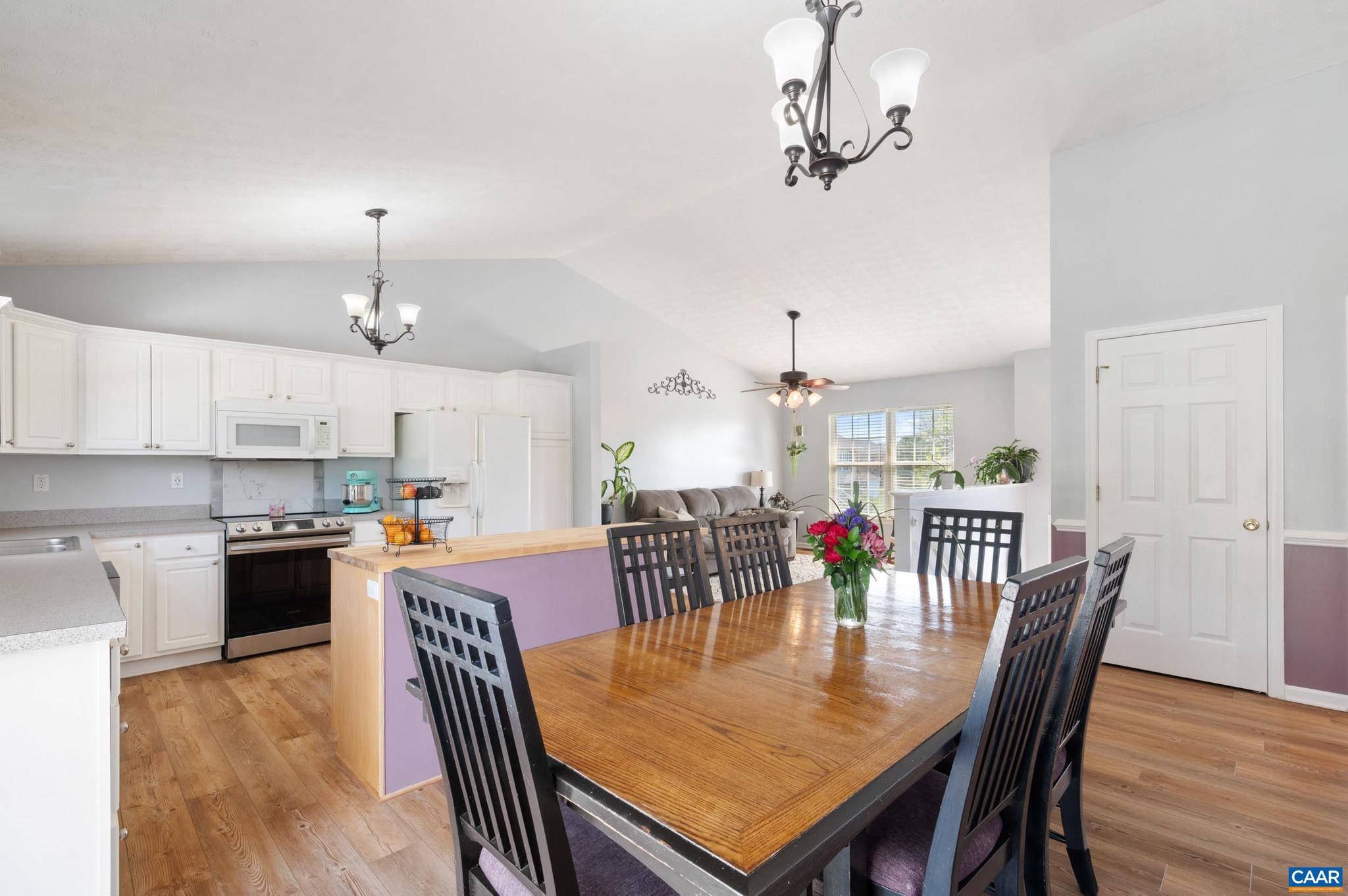 225 Mayfield La Waynesboro, VA 22980 - Photo 9 of 56 a view of a dining room with furniture a chandelier and wooden floor