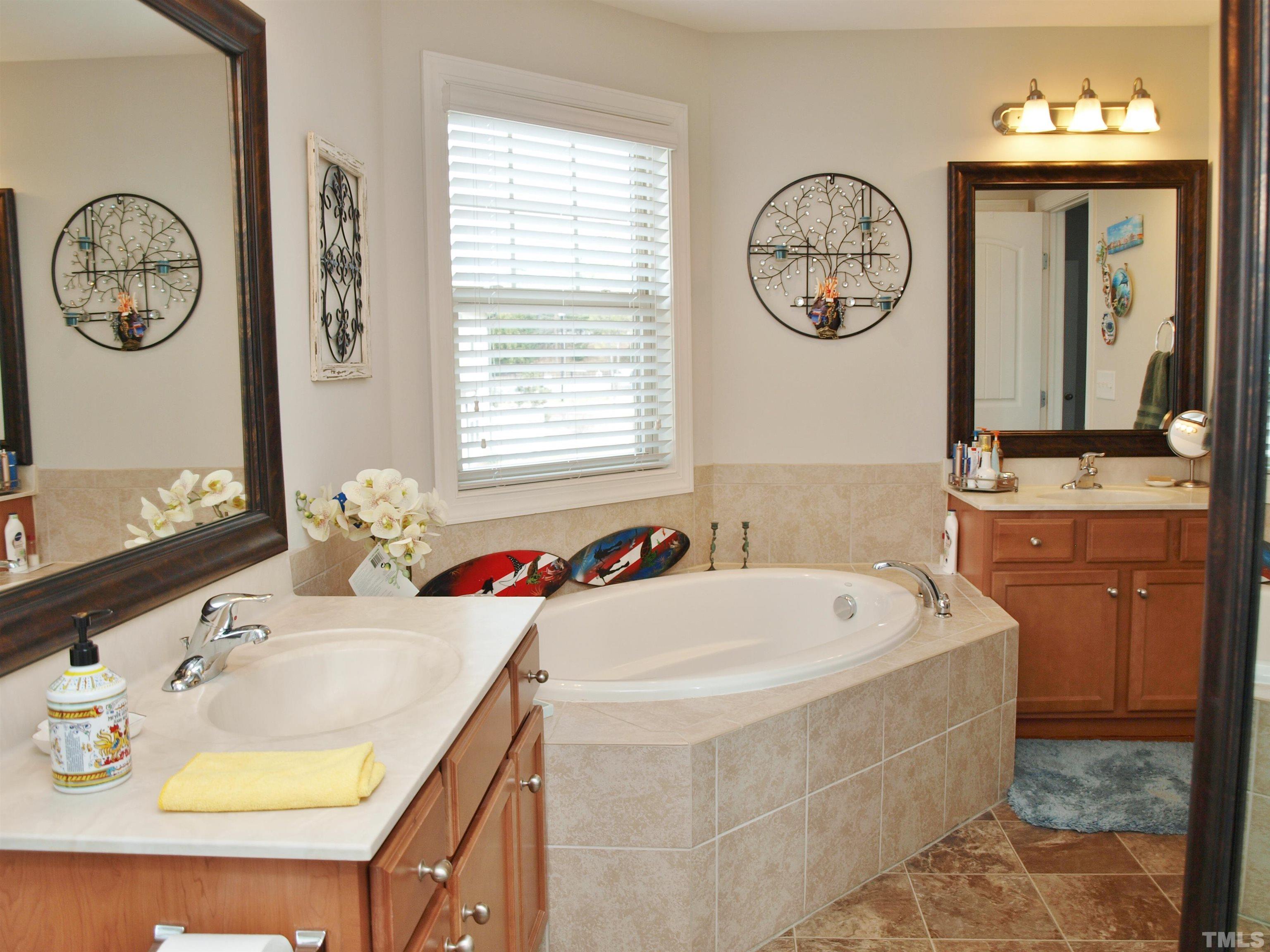 7613 Weathered Oak Way Raleigh, NC 27616 - Photo 11 of 22 Vanity with dual sinks in this roomy bathroom.