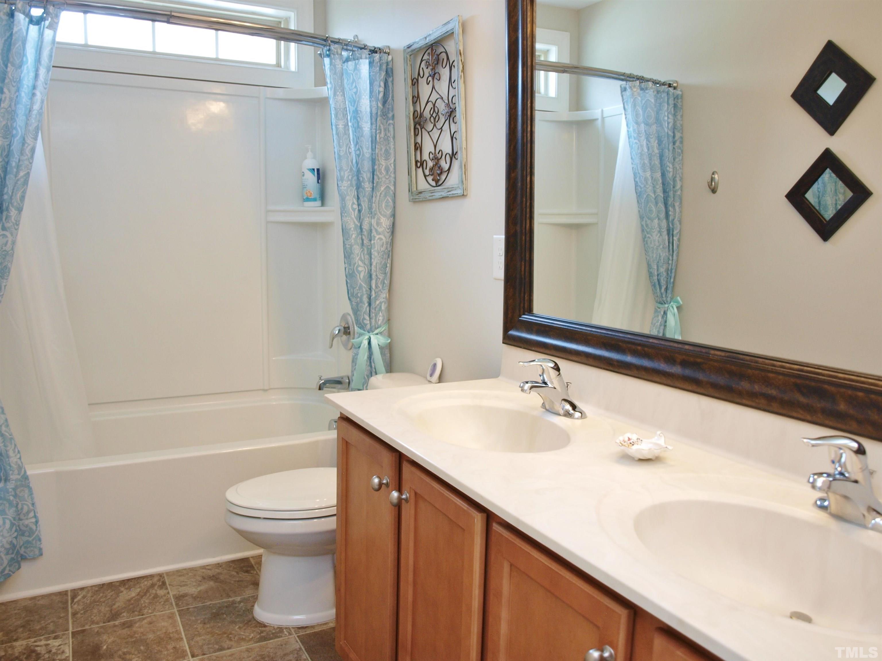 7613 Weathered Oak Way Raleigh, NC 27616 - Photo 15 of 22 This bathroom has a double sink vanity, too!