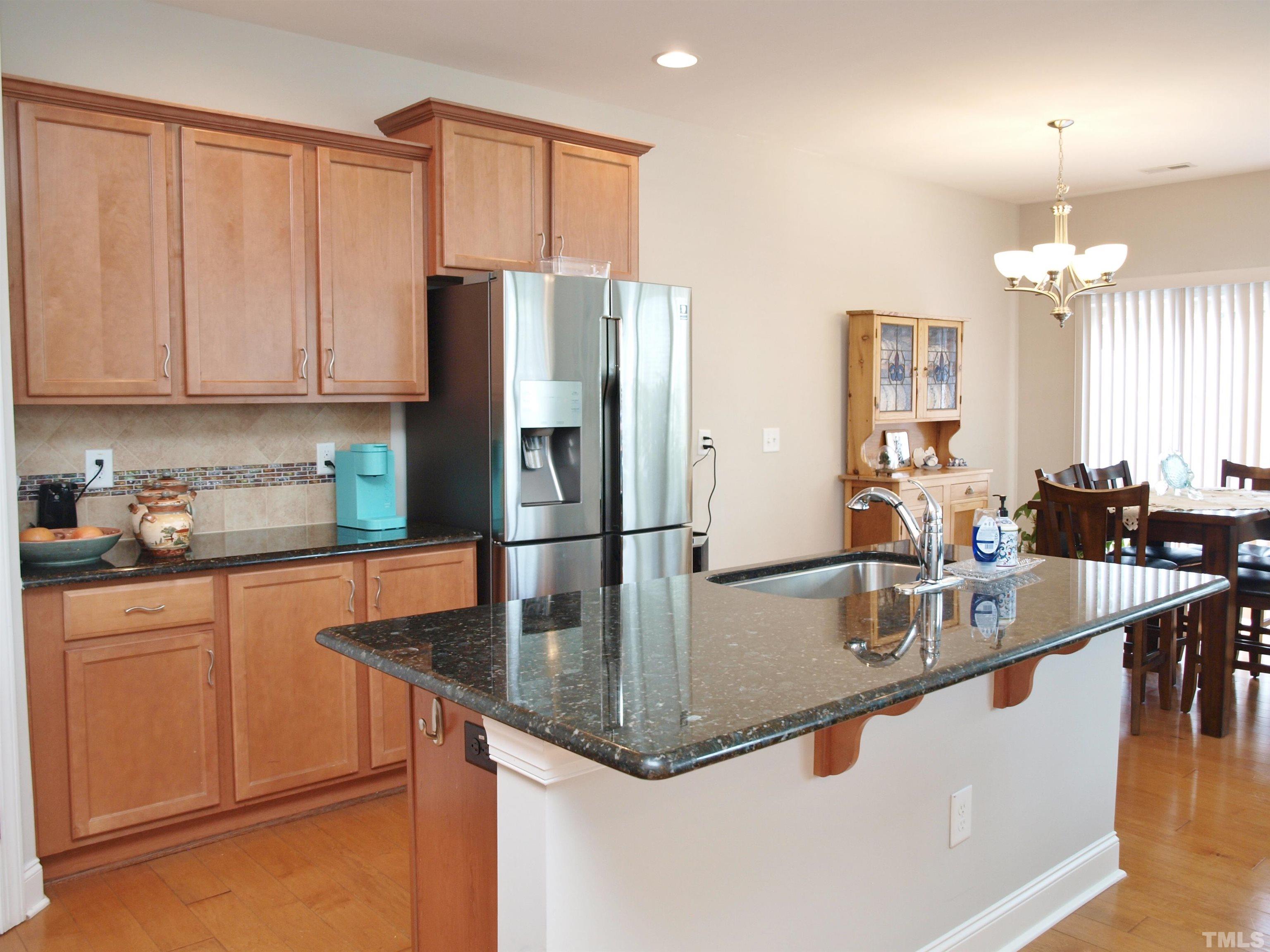 7613 Weathered Oak Way Raleigh, NC 27616 - Photo 5 of 22 Granite island and counter tops.