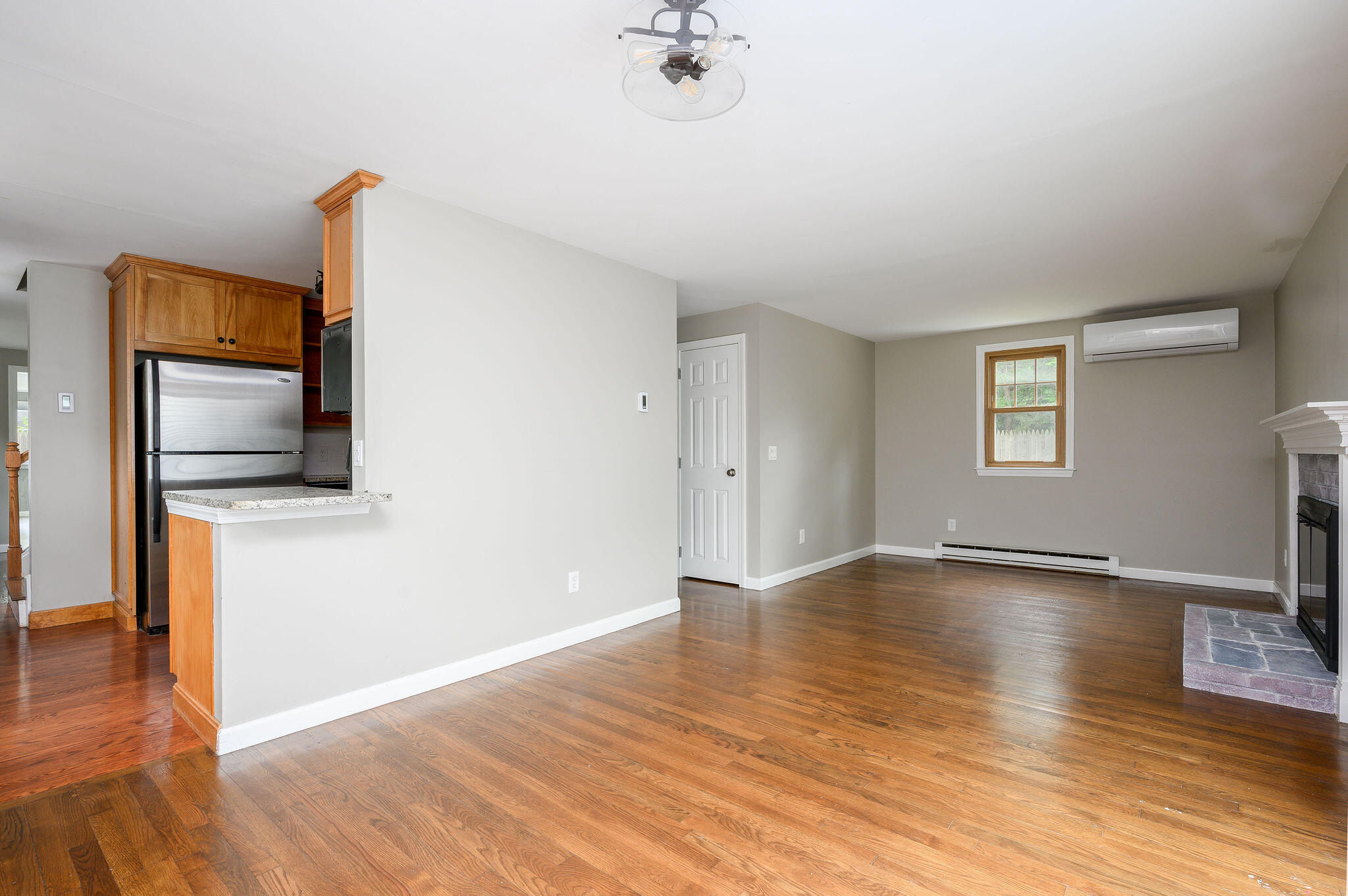 54 Beechwood Drive Mashpee, MA 02649 - Photo 11 of 34 a view of an empty room with wooden floor and a window