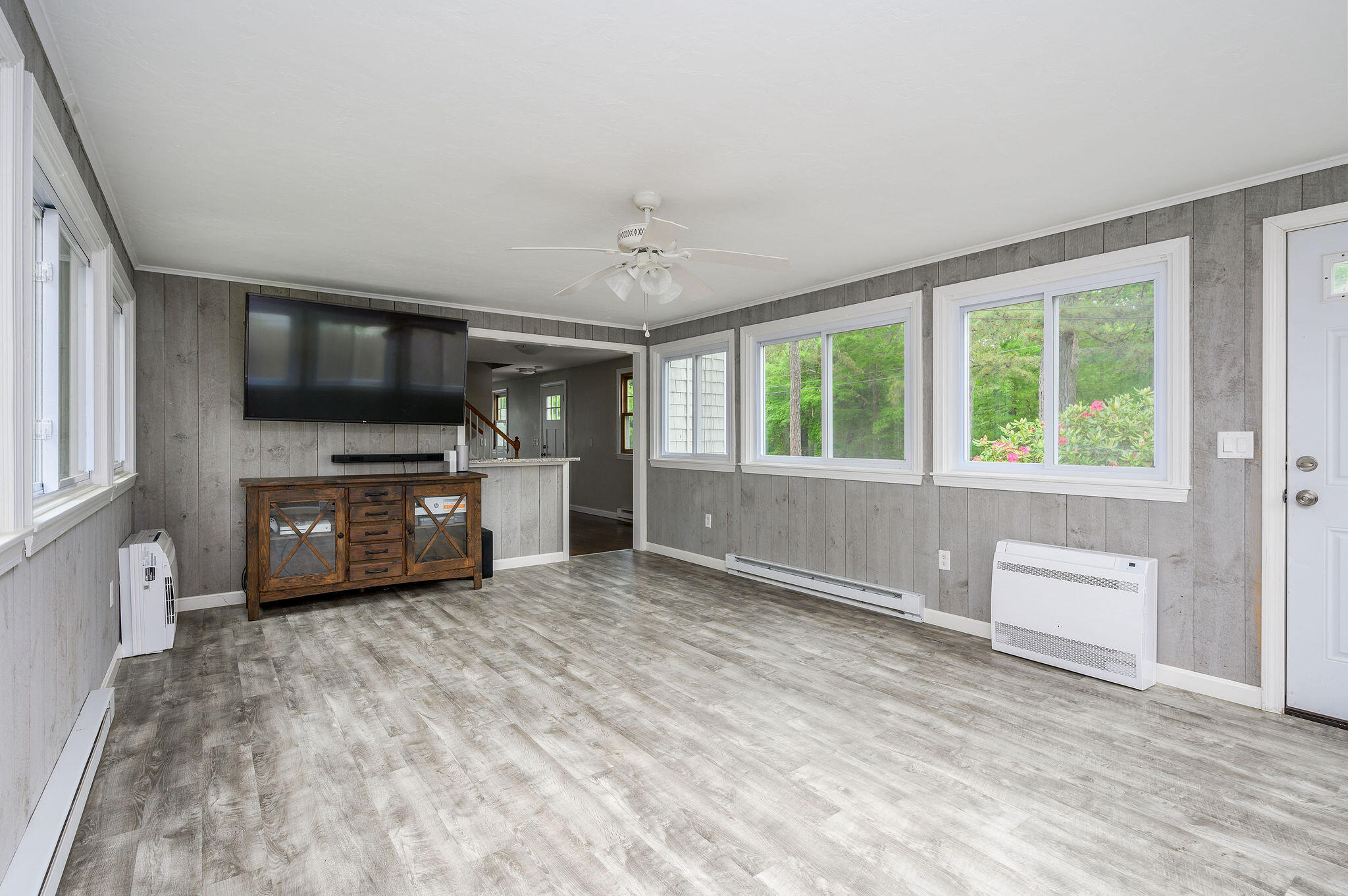 54 Beechwood Drive Mashpee, MA 02649 - Photo 13 of 34 a view of an empty room with a window and a kitchen
