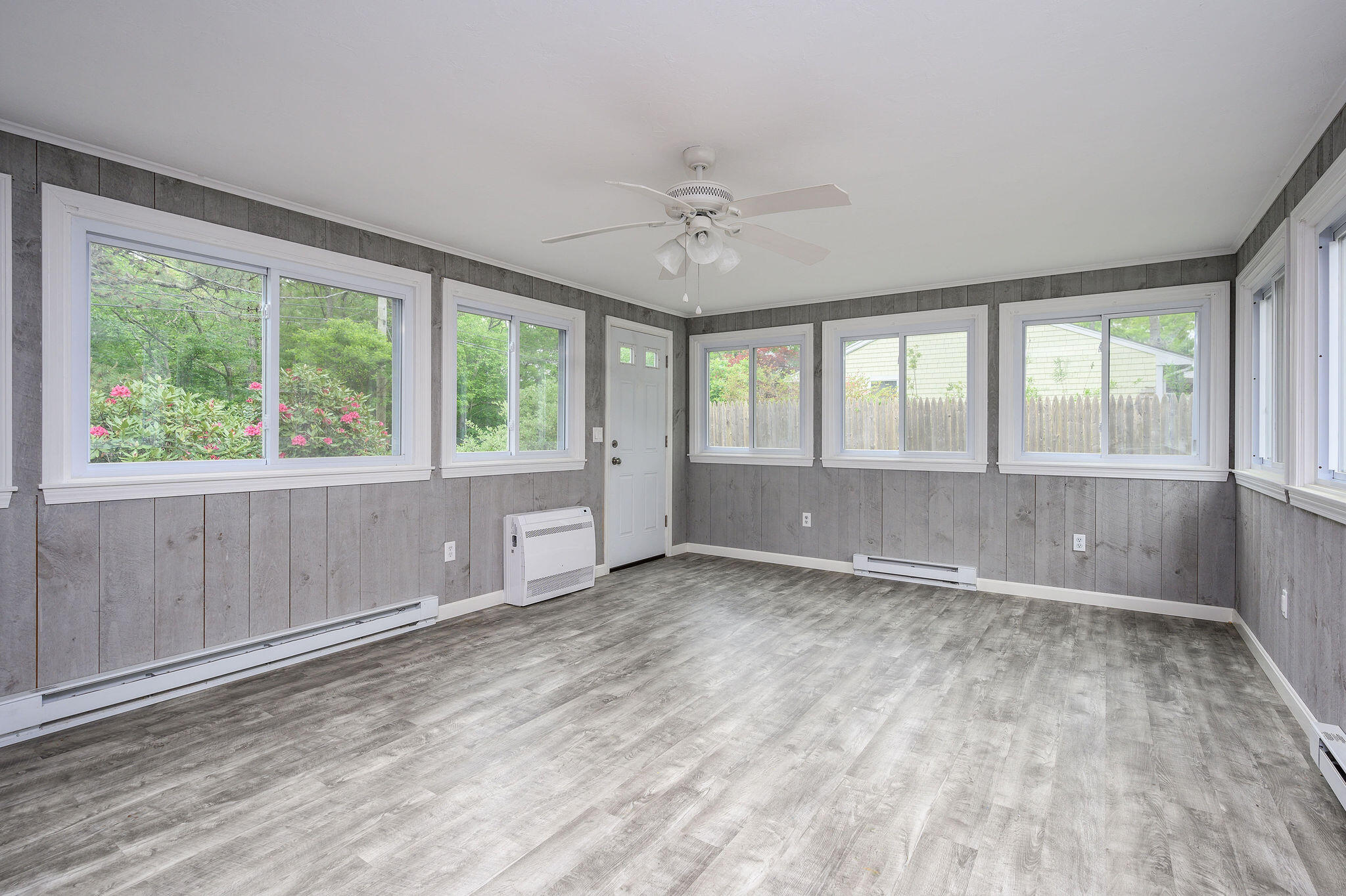 54 Beechwood Drive Mashpee, MA 02649 - Photo 14 of 34 wooden floor in an empty room with a window