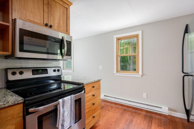 a kitchen with a stove and a microwave