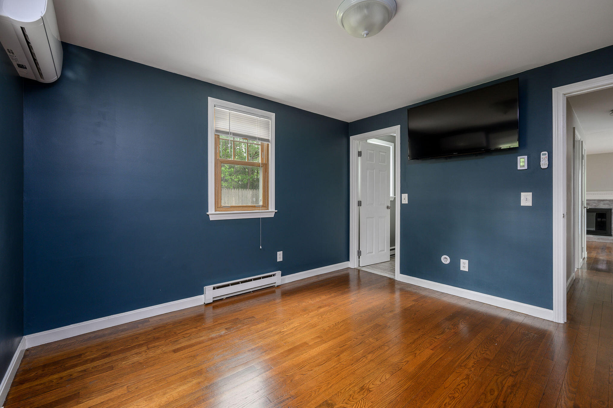 54 Beechwood Drive Mashpee, MA 02649 - Photo 20 of 34 a view of empty room with wooden floor and fan