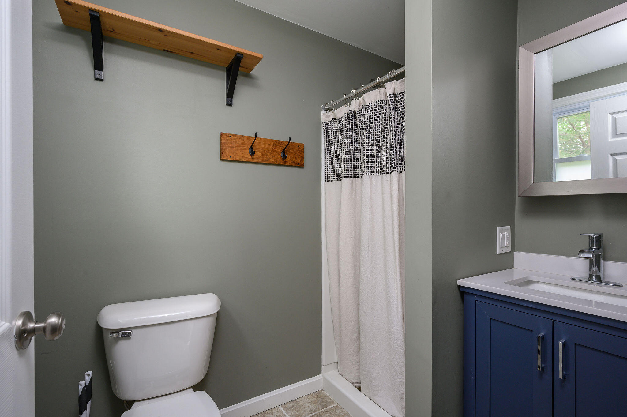 54 Beechwood Drive Mashpee, MA 02649 - Photo 22 of 34 a bathroom with a toilet sink and mirror