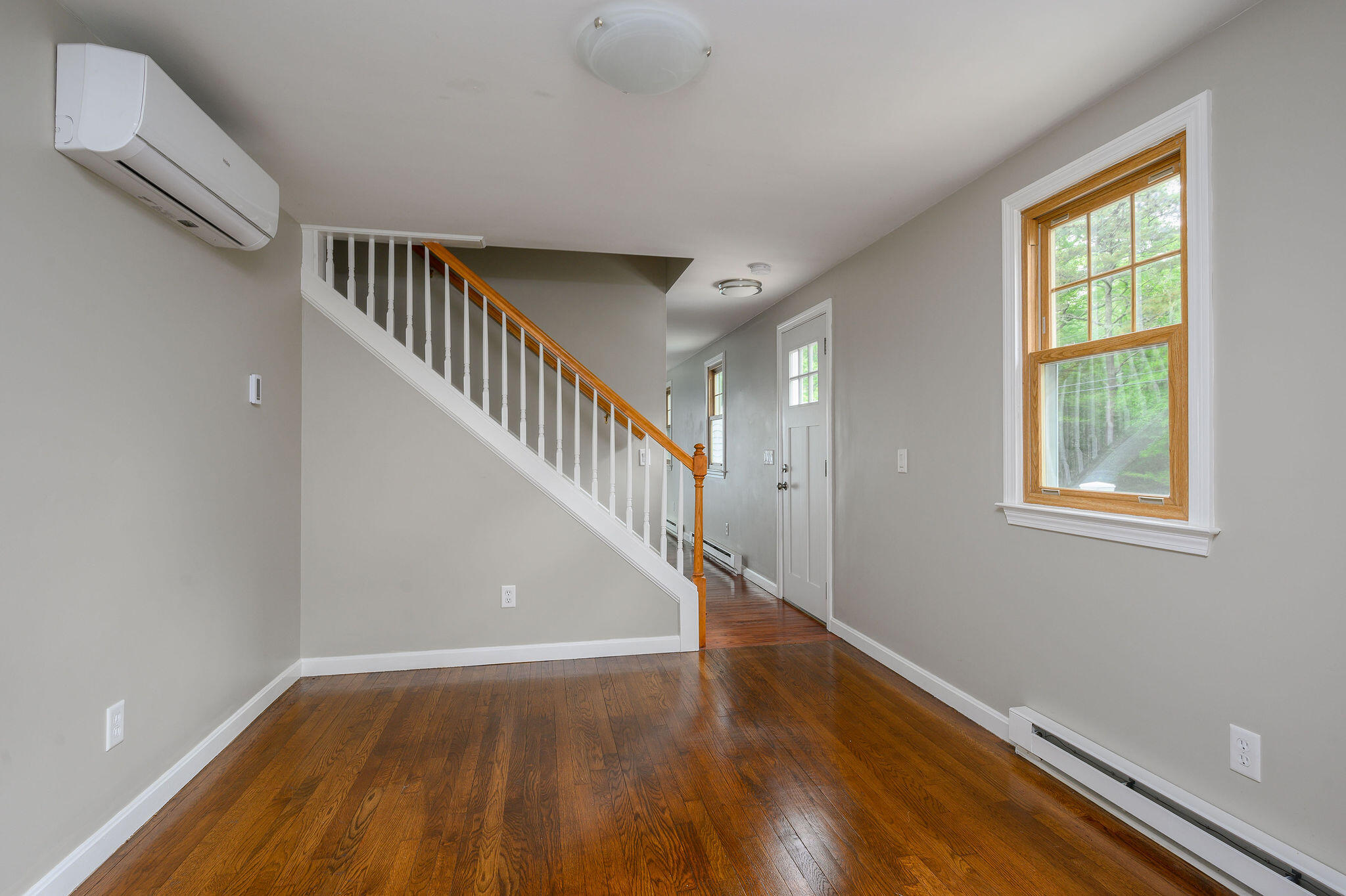 54 Beechwood Drive Mashpee, MA 02649 - Photo 23 of 34 a view of entryway with wooden floor and stairs