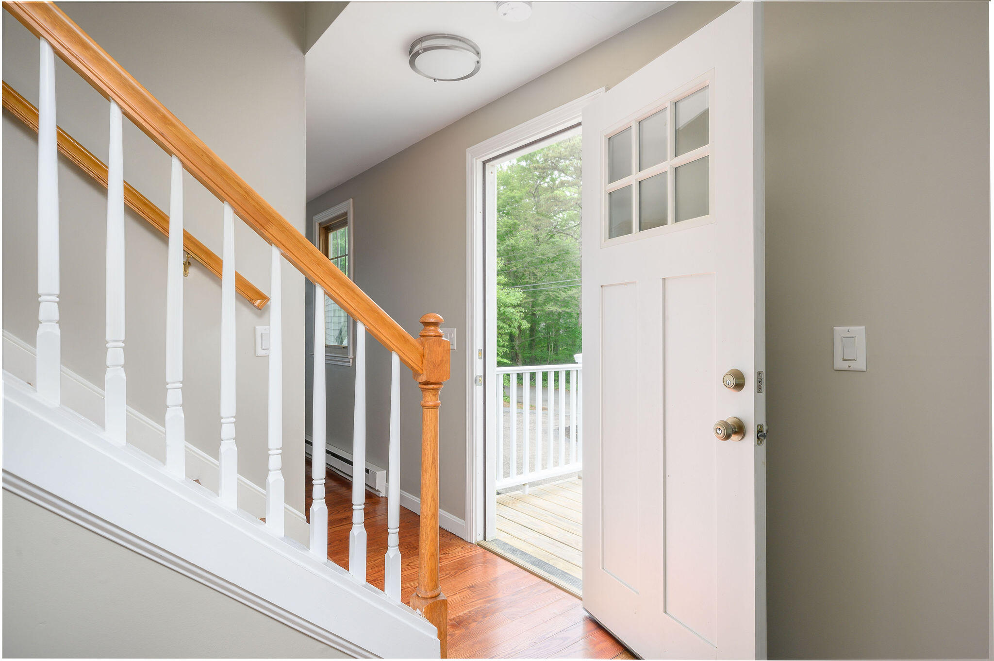 54 Beechwood Drive Mashpee, MA 02649 - Photo 25 of 34 a view of an entryway with wooden floor and door