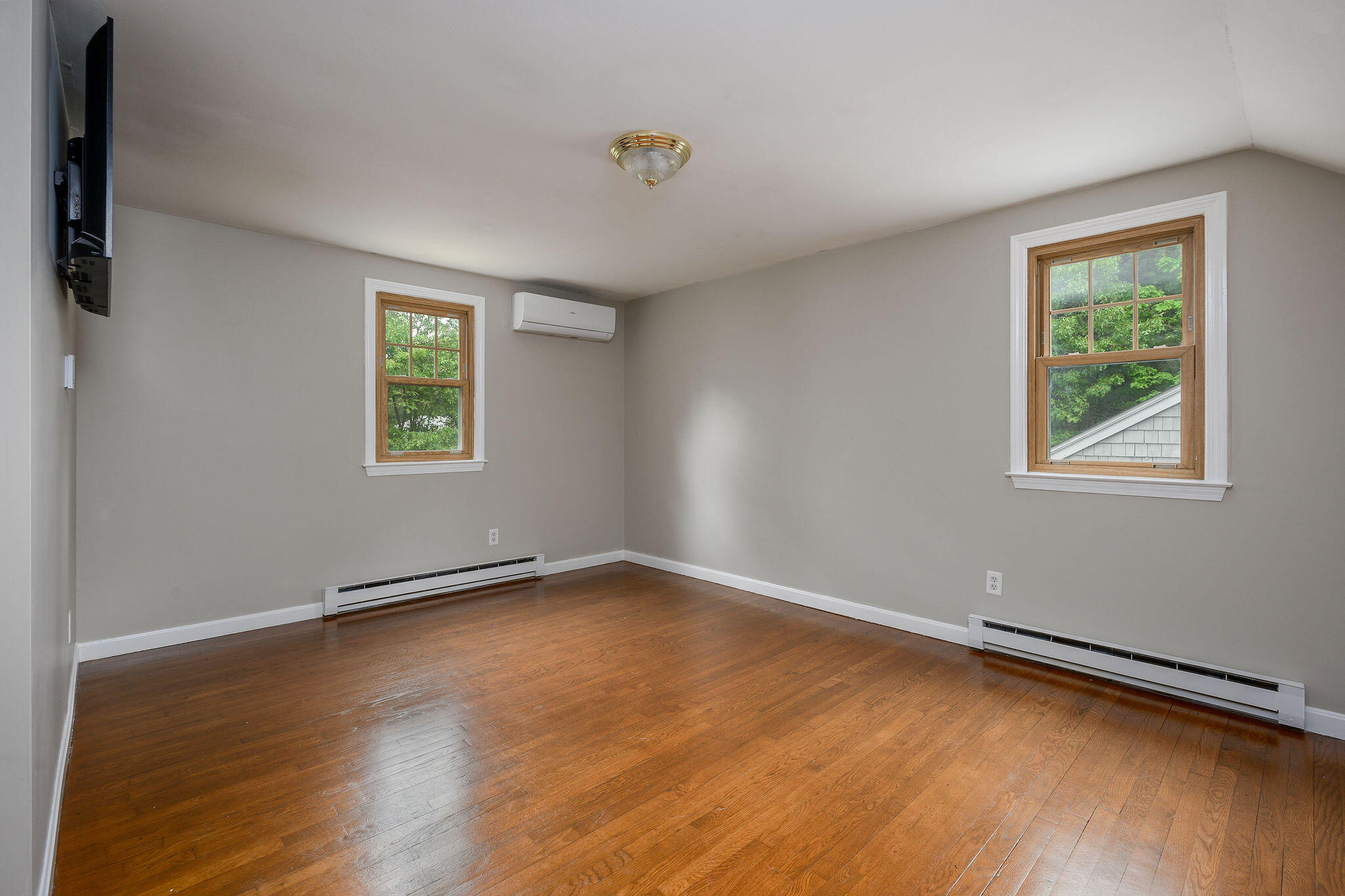 54 Beechwood Drive Mashpee, MA 02649 - Photo 26 of 34 a view of an empty room with a window and wooden floor