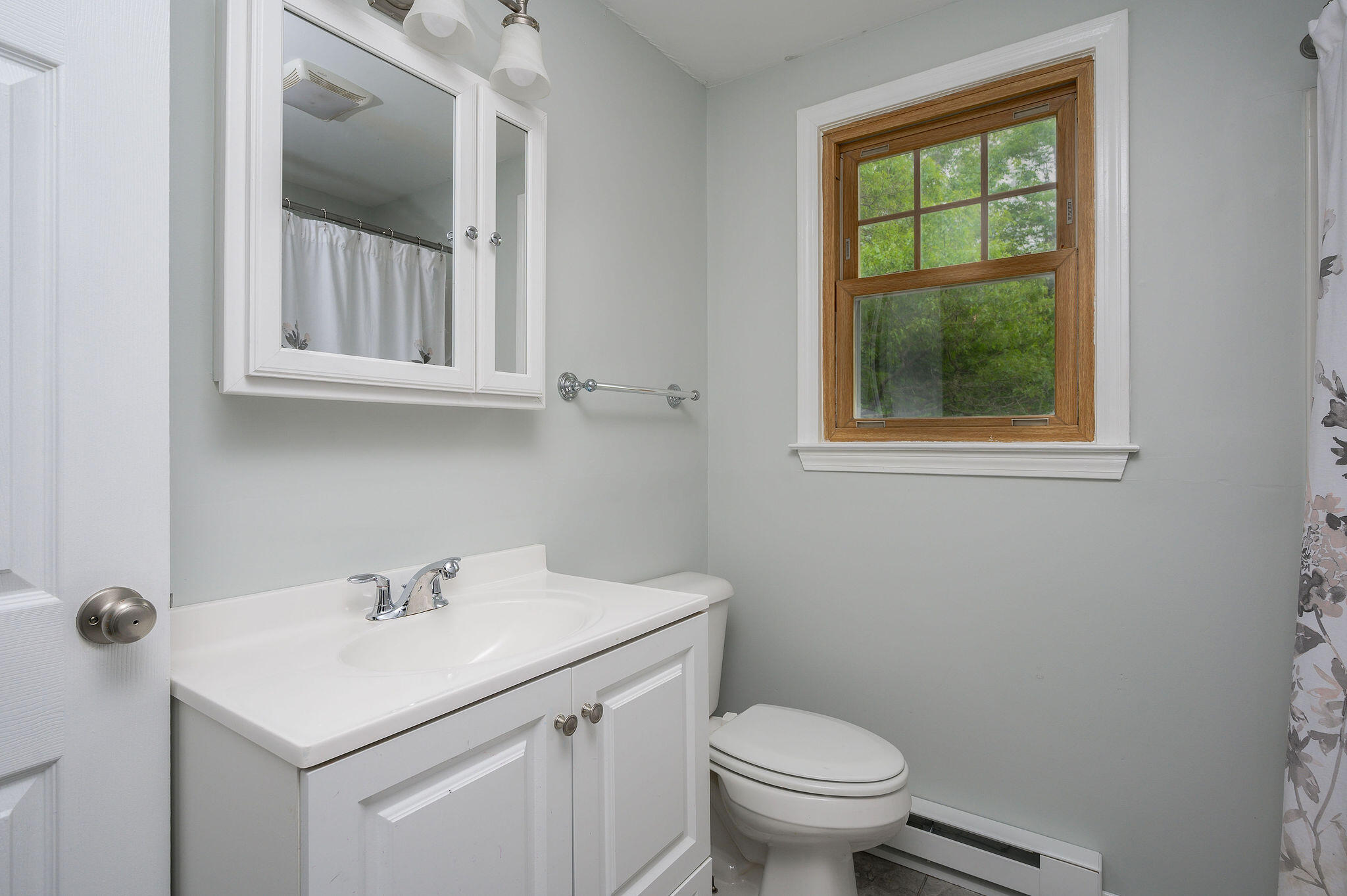54 Beechwood Drive Mashpee, MA 02649 - Photo 29 of 34 a bathroom with a sink toilet and a window