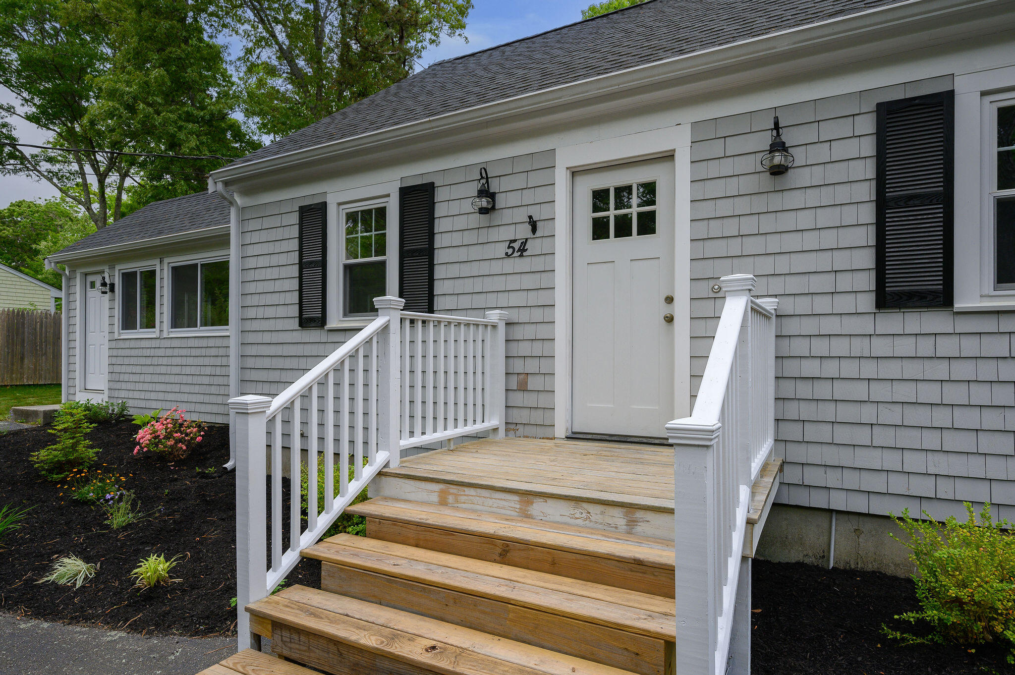 54 Beechwood Drive Mashpee, MA 02649 - Photo 3 of 34 a view of front door and potted plants