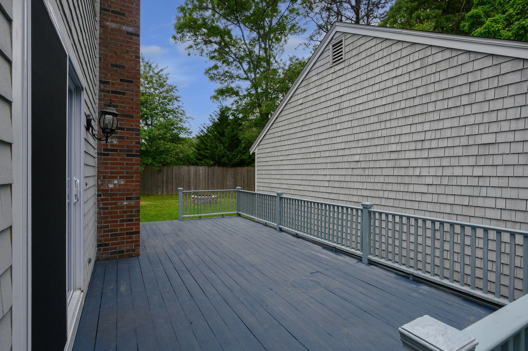 54 Beechwood Drive Mashpee, MA 02649 - Photo 6 of 34 a view of backyard with wooden fence
