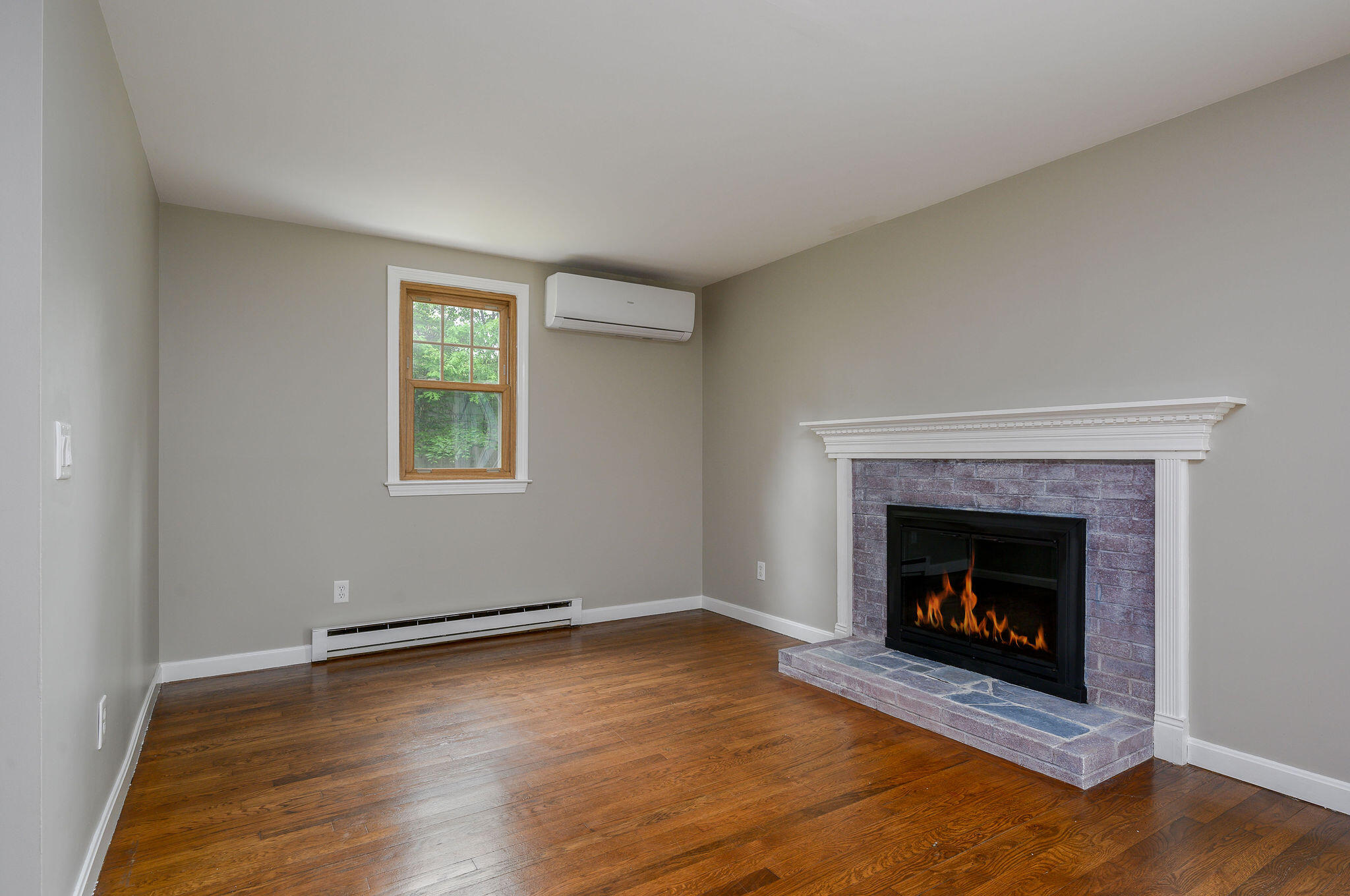 54 Beechwood Drive Mashpee, MA 02649 - Photo 10 of 34 a living room with a fireplace and a fireplace