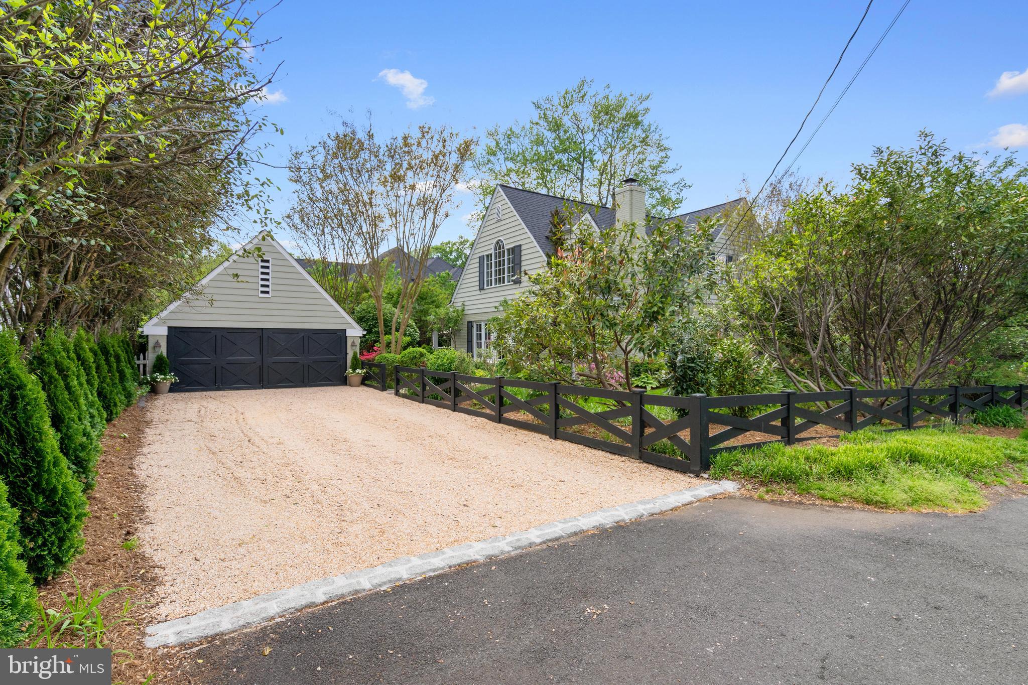 6511 Ridge Street McLean, VA 22101 - Photo 17 of 17 a front view of a house with a yard and trees