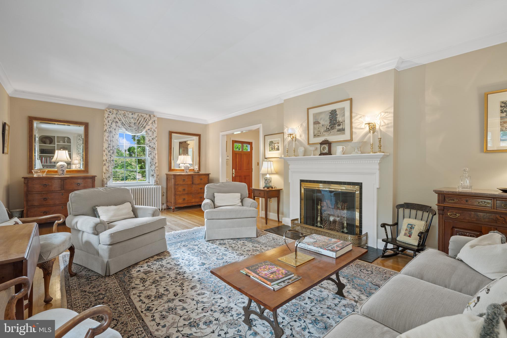 6511 Ridge Street McLean, VA 22101 - Photo 6 of 17 a living room with furniture fireplace and window