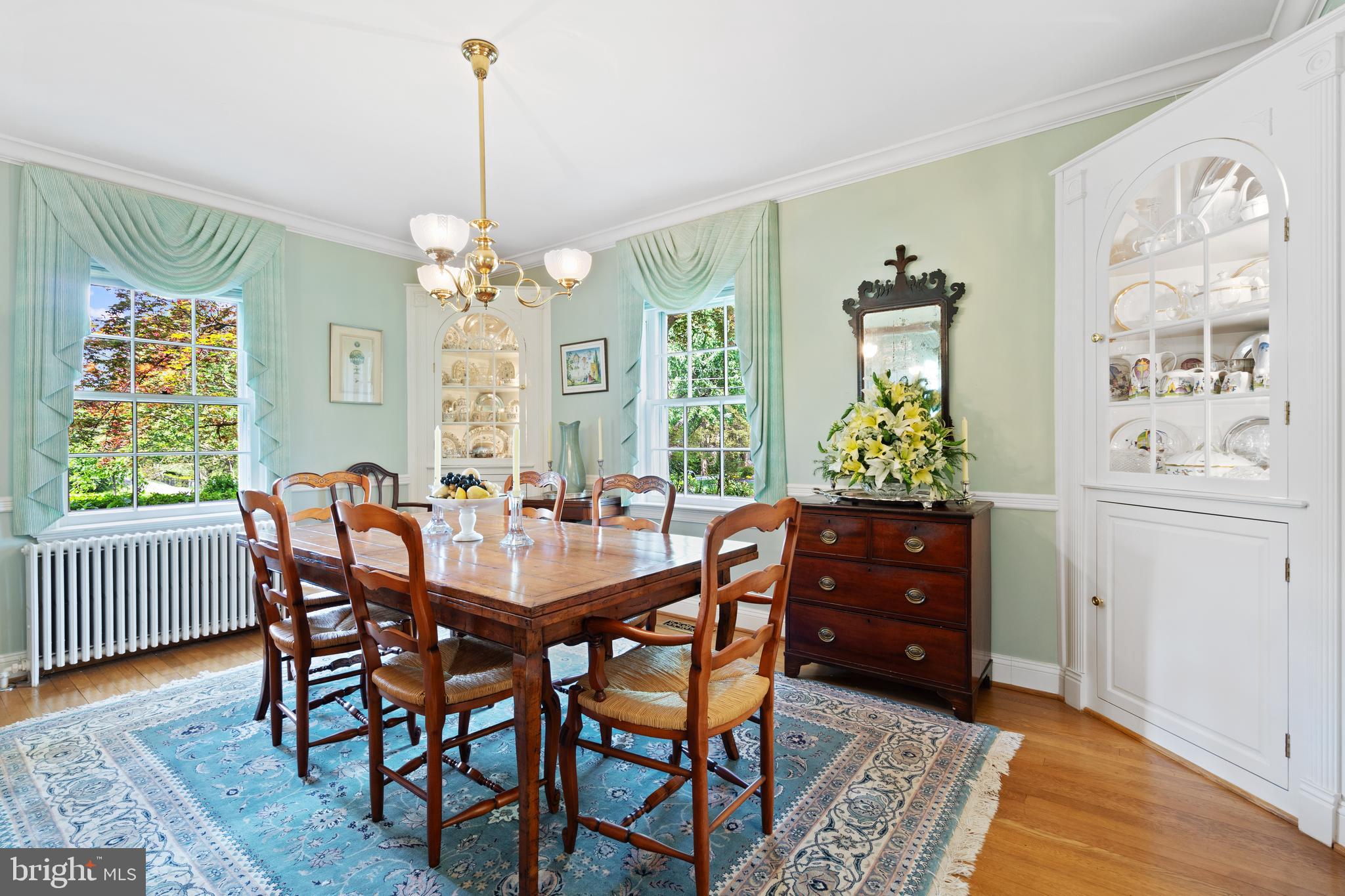 6511 Ridge Street McLean, VA 22101 - Photo 8 of 17 a dining room with furniture a chandelier and wooden floor