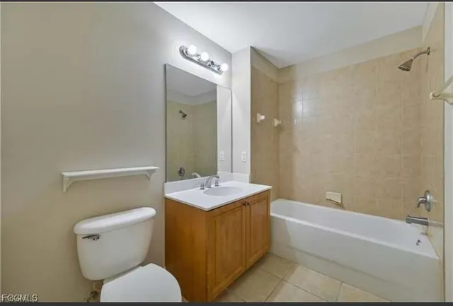 a bathroom with a sink a toilet and bathtub