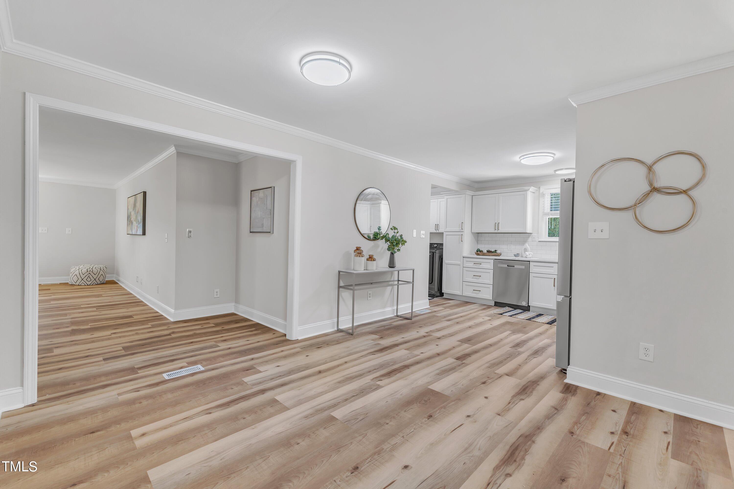 3440 Apache Drive Raleigh, NC 27609 - Photo 19 of 47 a view of a kitchen with wooden floor and seating space